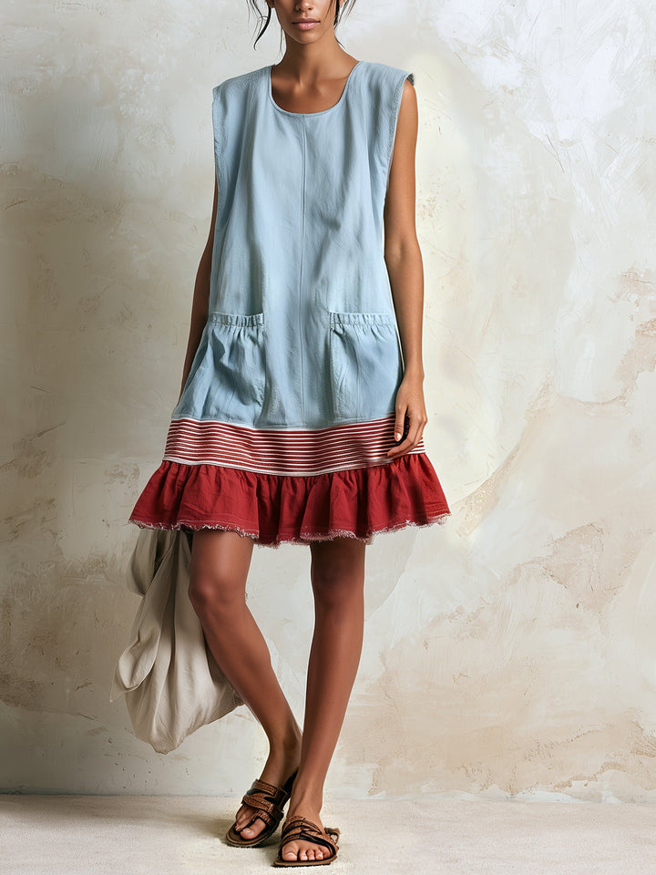Stylish women's blue mini dress featuring a tiered ruffle hem with contrast trim, great for warm weather.