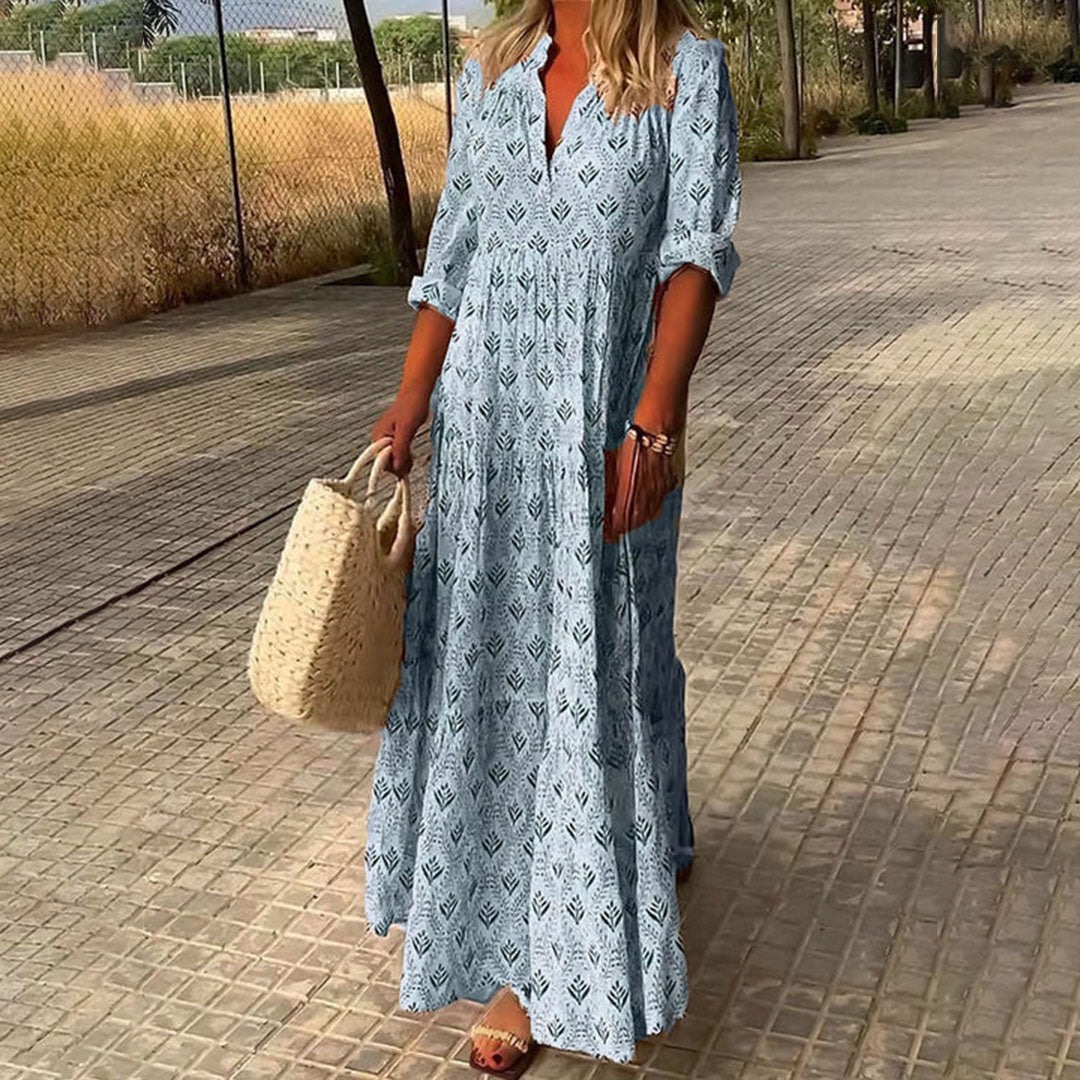 Close-up of vibrant boho print on a women's V-neck maxi dress, showcasing expressive style and fabric texture.