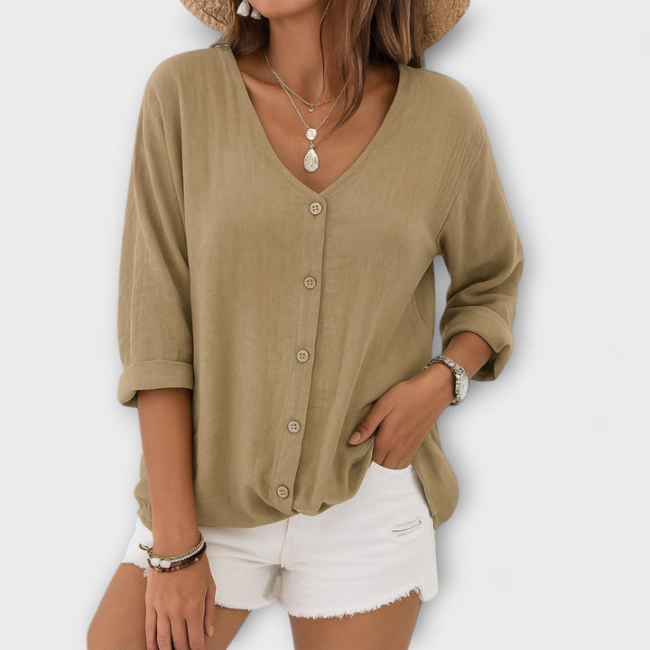 Relaxed fit long sleeve women's button-up shirt, a versatile v-neck casual blouse for everyday summer style.