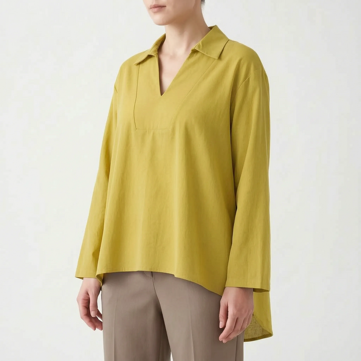 Effortless women's casual tunic with a stylish high-low hem. Loose fit, long sleeve, v-neck for comfort.