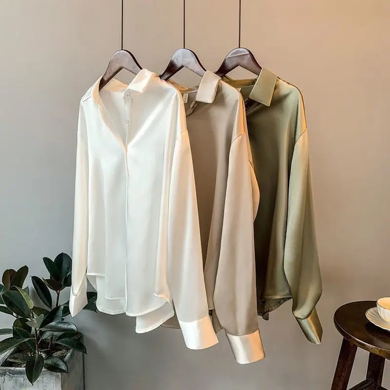 Woman modeling a casual long-sleeve Effortless Chic blouse. Perfect for comfortable everyday wear and versatile spring fashion.