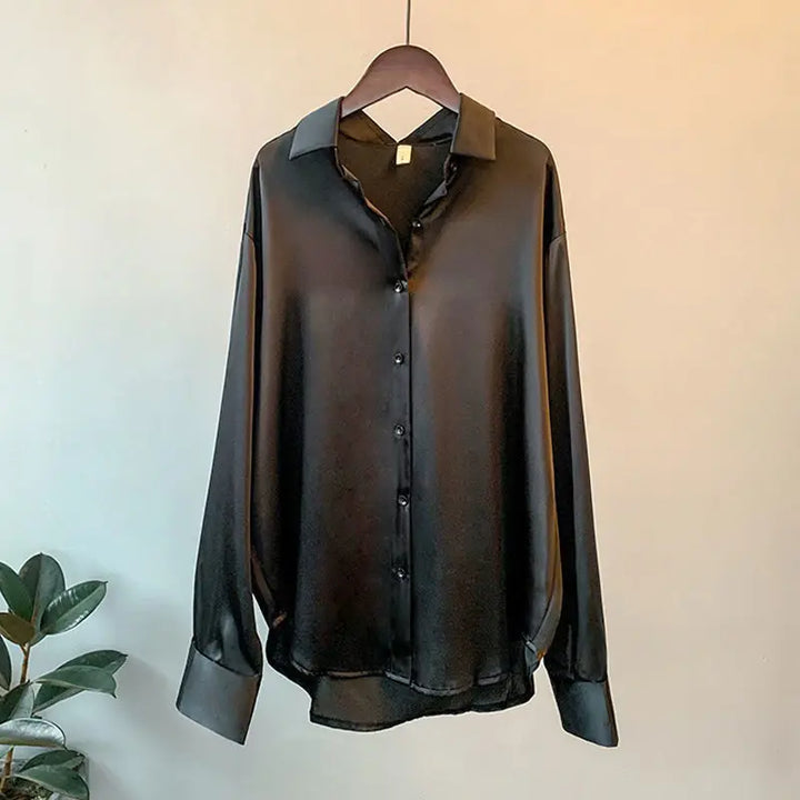 Stylish woman in an elegant long-sleeve Effortless Chic work blouse. Ideal for office wear, professional settings, or chic spring outfits.