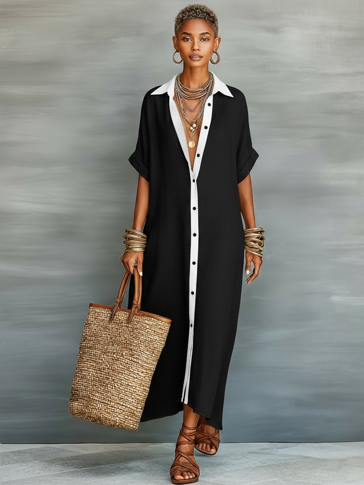 Relaxed fit collared maxi dress for women, featuring a stylish button front and comfortable elbow sleeves.