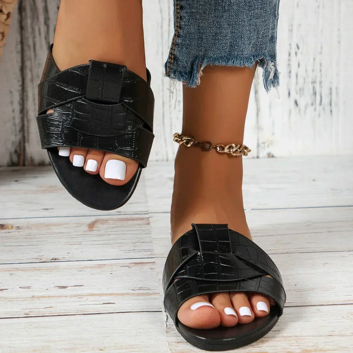 Women's casual comfort slide sandals, a lightweight slip-on design for effortless summer style.