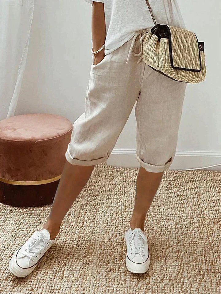 Versatile women's summer shorts with elastic drawstring waist & practical pockets, ideal for loungewear or daily tasks.