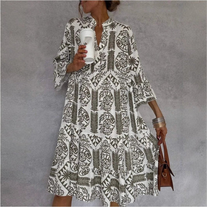 Light blue floral print tiered sundress for women, boho tunic style, ideal for summer & resort wear.
