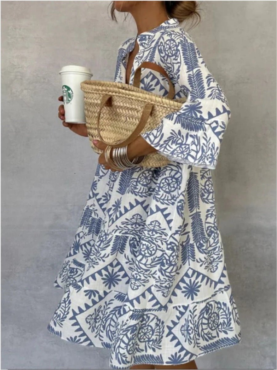Stylish tiered floral sundress for women, boho tunic style in light blue, perfect for warm weather.