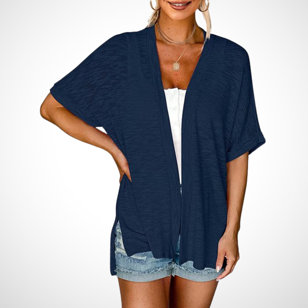 Flowing short sleeve women's cardigan. Elegant, lightweight layering piece for comfortable summer wear.