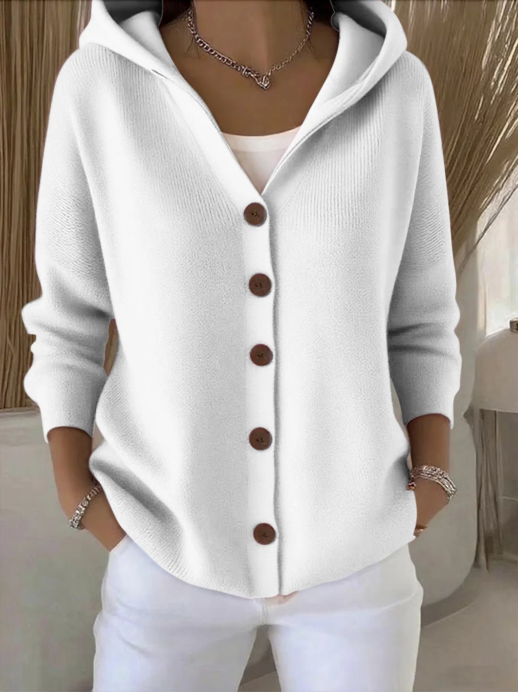 Comfortable women's hooded cardigan sweater, button-front design, effortless relaxed fit for layering.