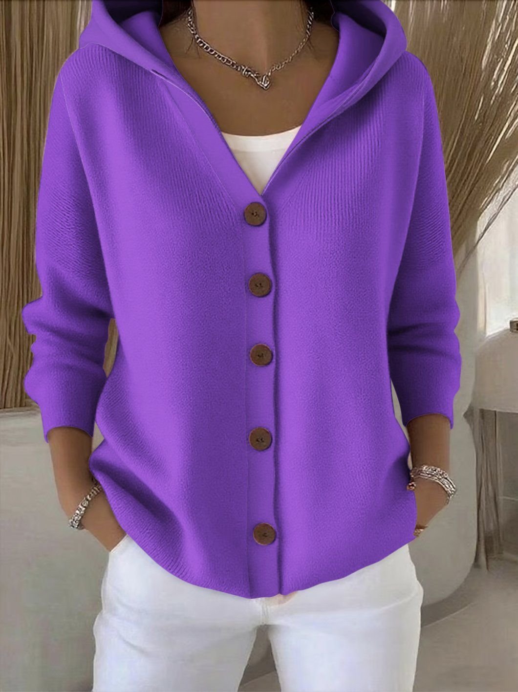 Versatile women's relaxed hooded button-front sweater, ideal for layering and effortless style.