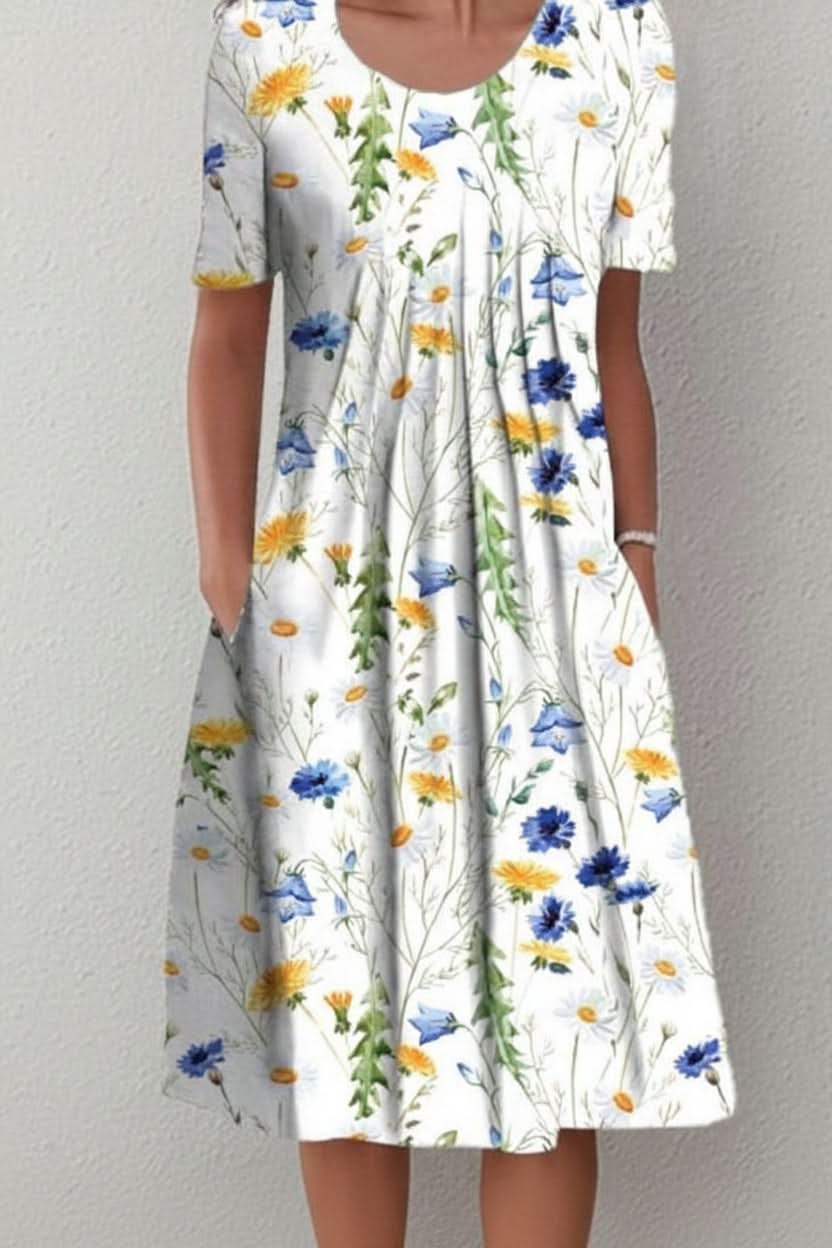 Comfortable knee-length dress for women. Effortless everyday style, available in floral/polka dot.
