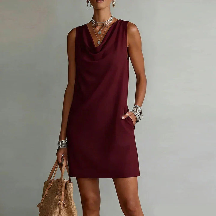 Lightweight & breathable women's mini dress, sleeveless design with practical pockets for effortless style.
