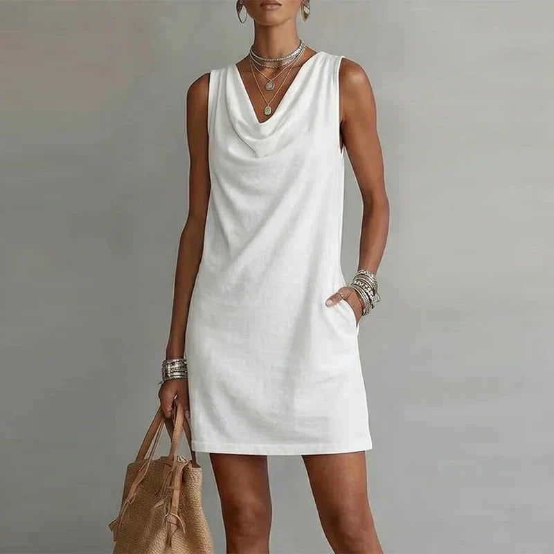 Effortless relaxed fit women's mini dress. Lightweight fabric & sleeveless design ensure ultimate summer comfort.
