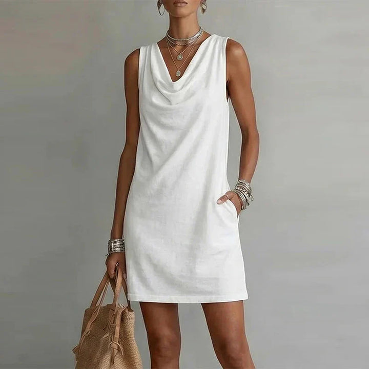 Effortless relaxed fit women's mini dress. Lightweight fabric & sleeveless design ensure ultimate summer comfort.