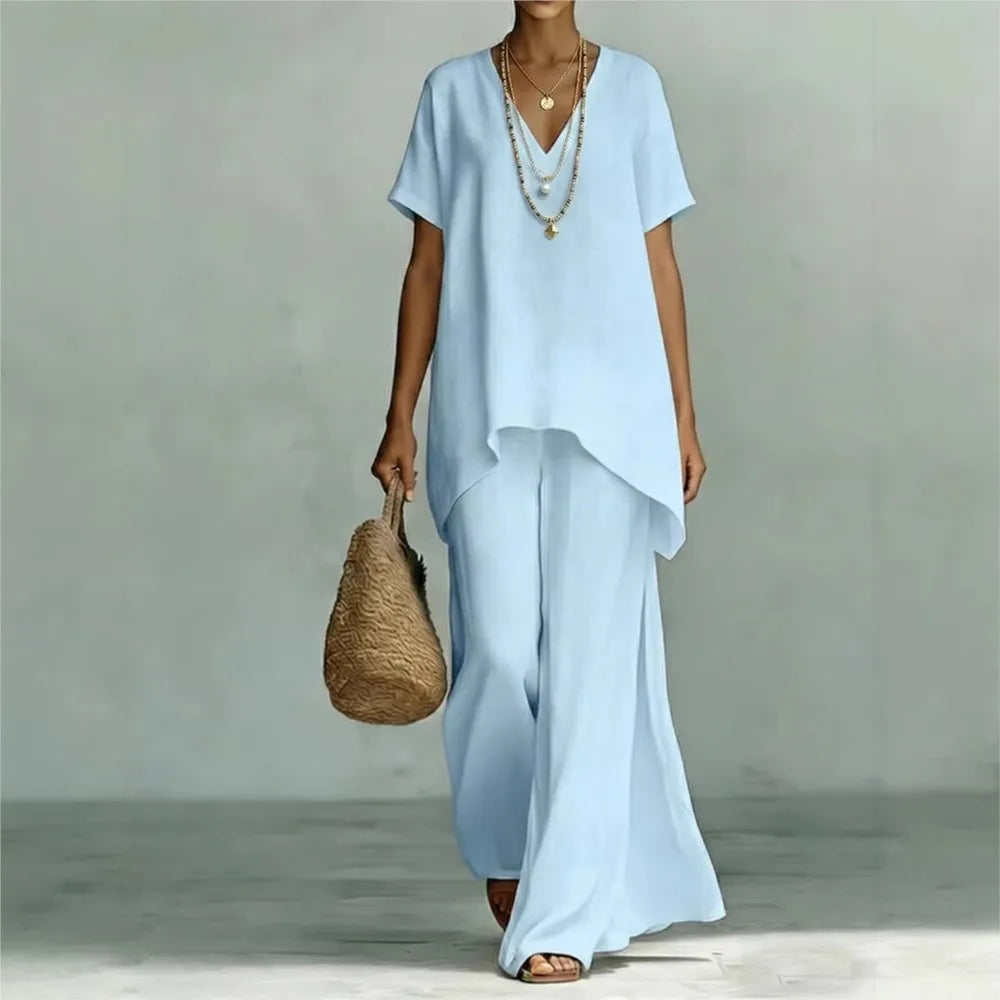 Women's effortless linen blend two-piece set, perfect for casual summer resort wear. Comfortable wide leg pants & asymmetrical top.