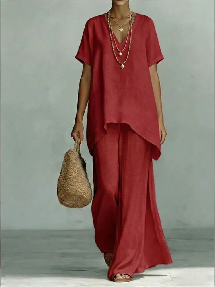 Women's casual linen blend two-piece matching set, styled for a relaxed summer vacation. Wide leg pants & stylish top.