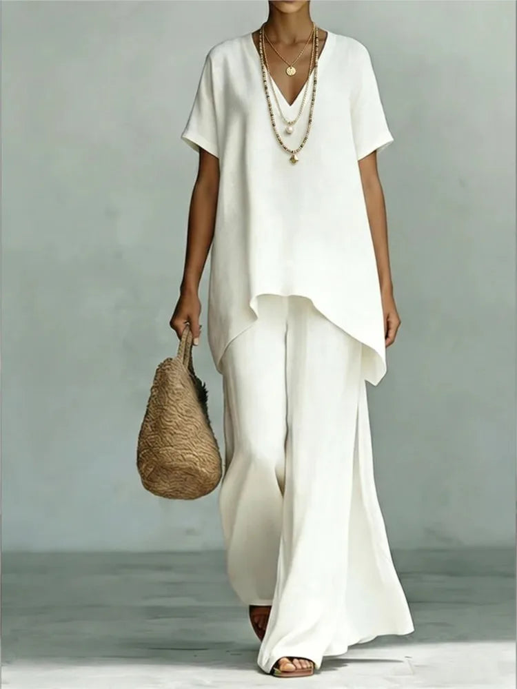Effortless women's linen blend two-piece set with comfortable wide leg pants and a chic asymmetrical top for summer wear.