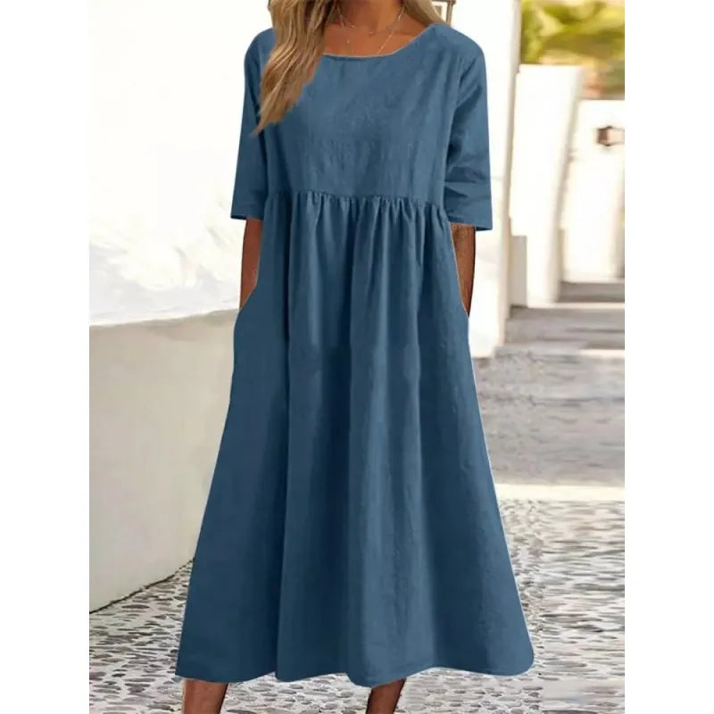 Flowing casual maxi dress for women featuring convenient pockets, half-sleeves, perfect for comfortable everyday style.