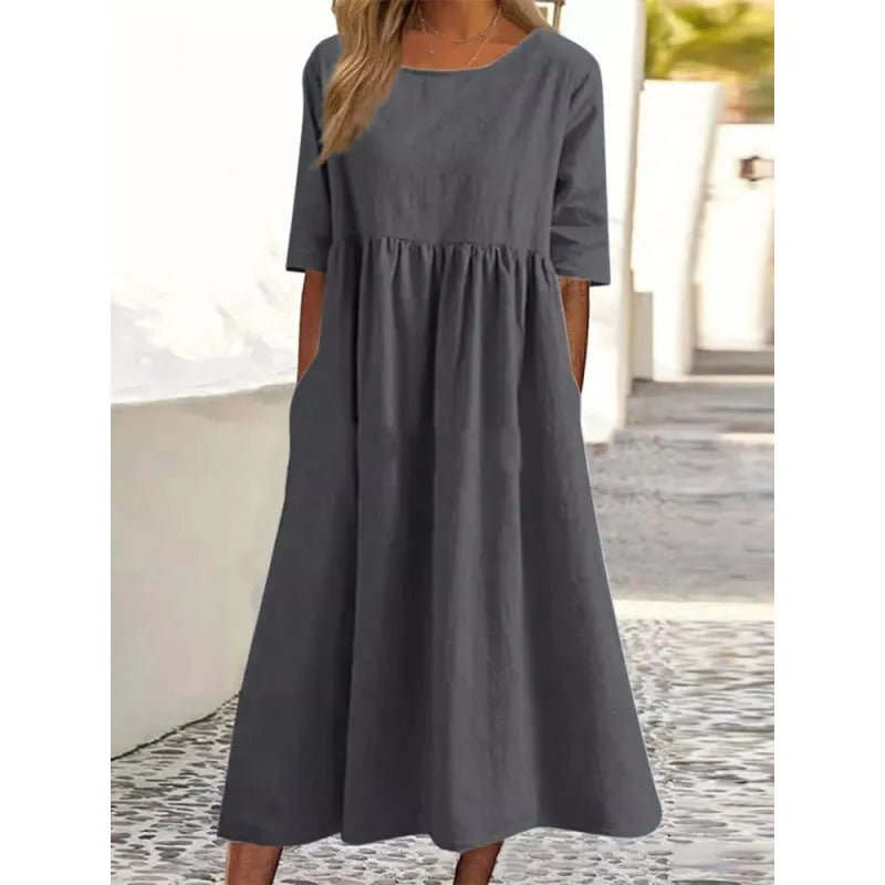 Stylish ladies' summer maxi dress; an effortless, comfortable design with half sleeves & pockets for versatile wear.