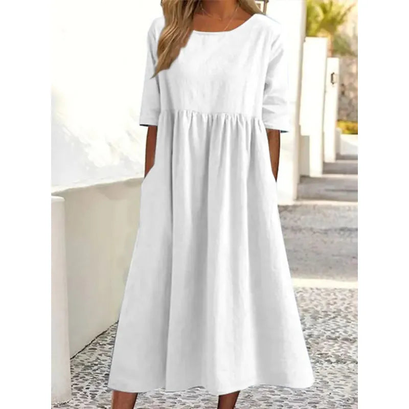 Women's casual maxi dress with half-sleeves and practical pockets, offering comfortable, modest, everyday fashion.