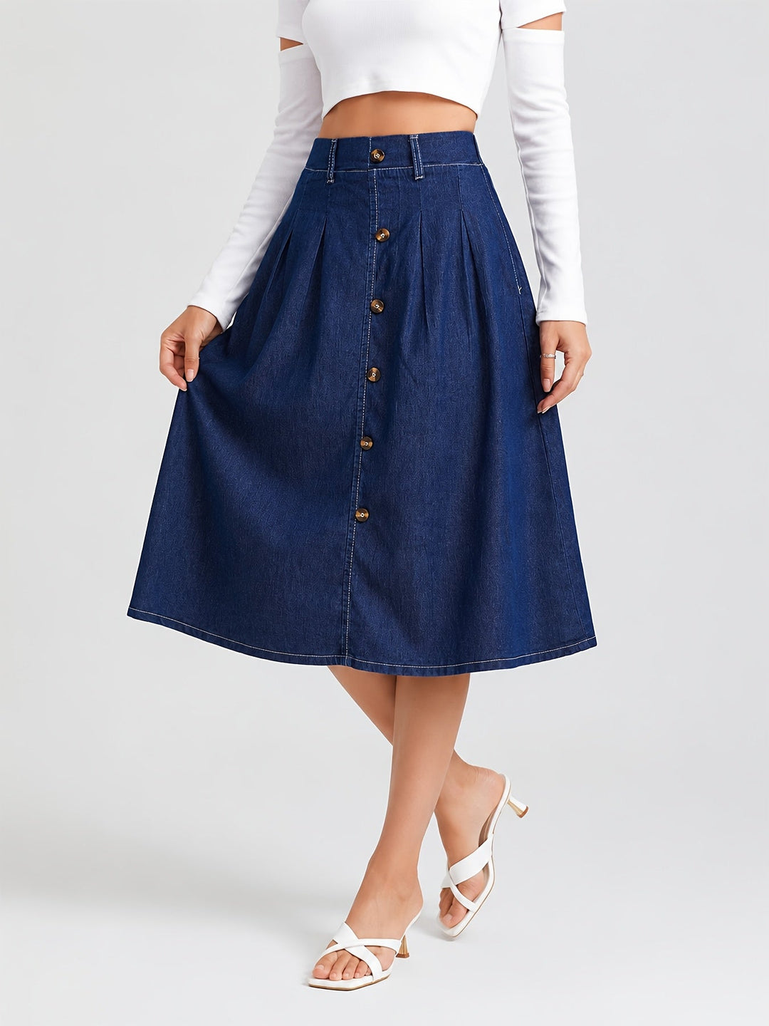 Women's effortless medium blue denim A-line midi skirt with button front. Casual and versatile everyday style.