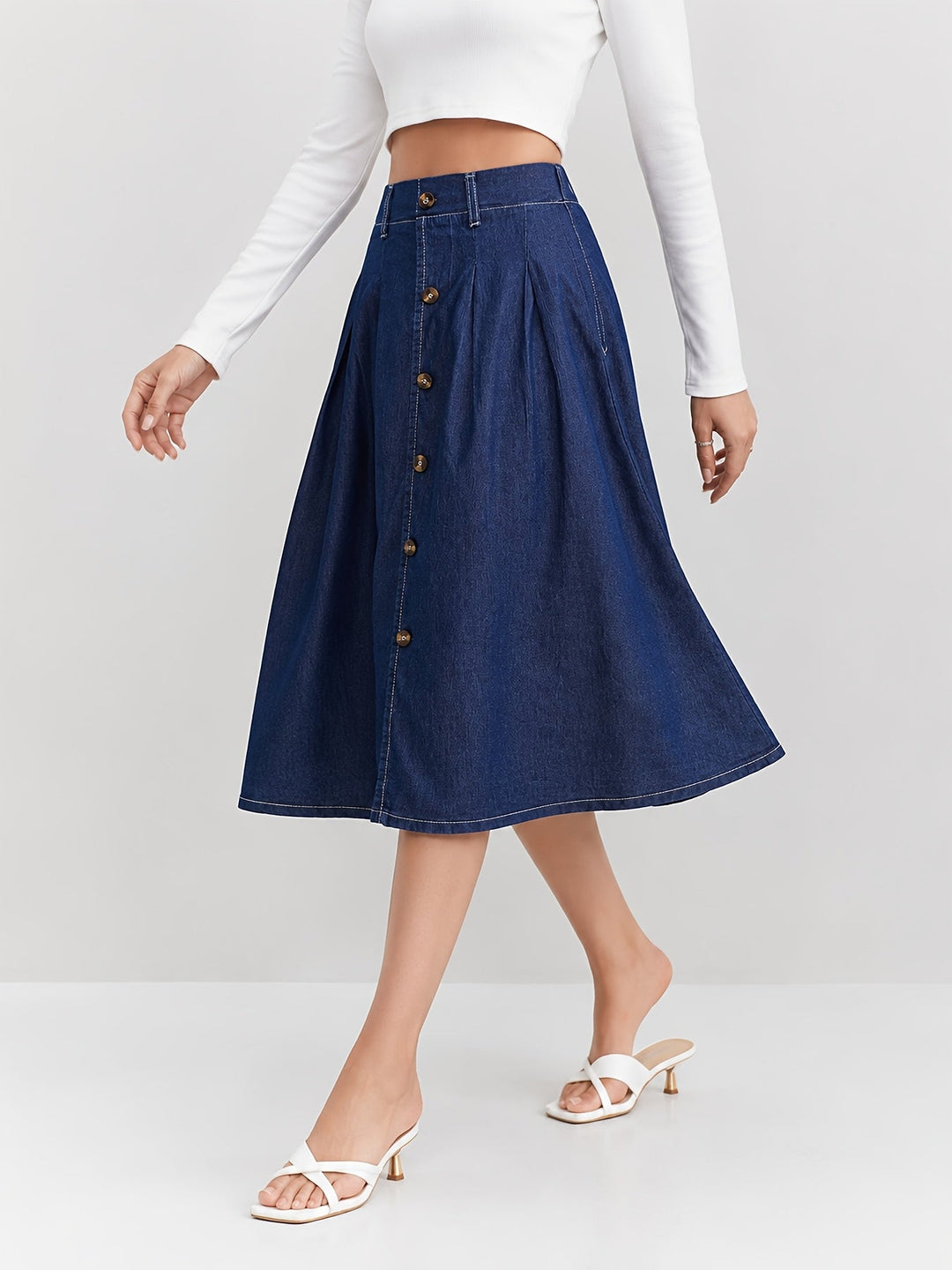 Effortless women's blue denim A-line midi skirt, ideal for casual wear. Features a stylish button-front.