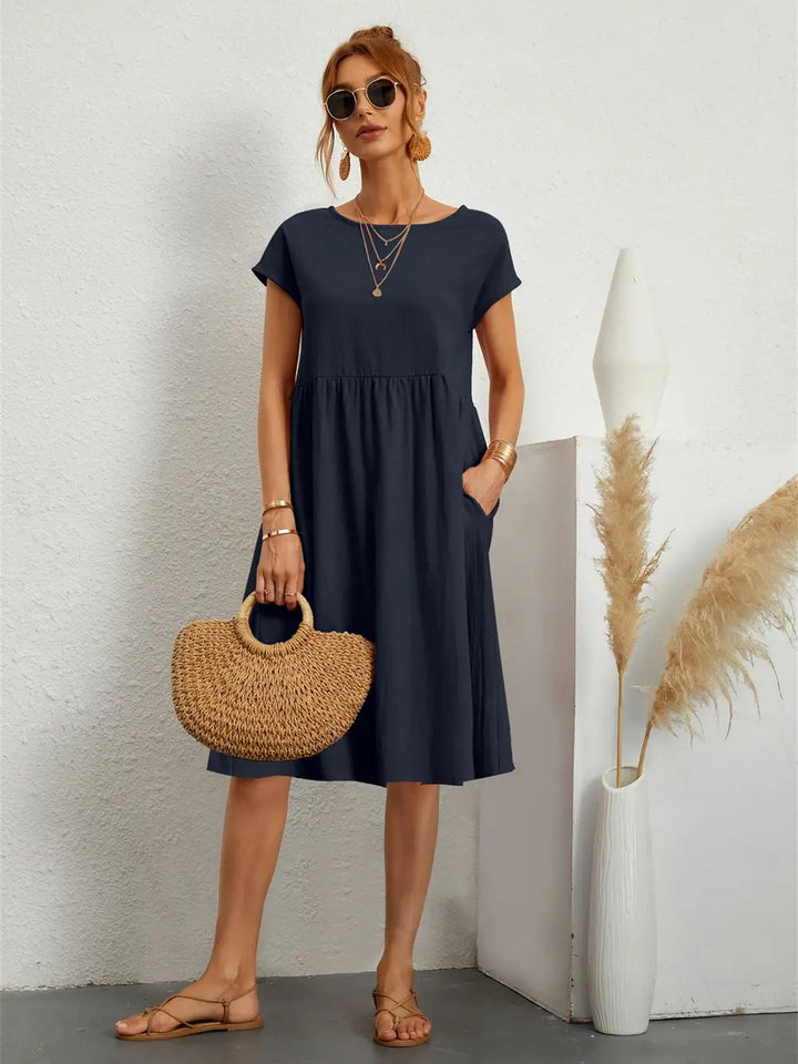 Stylish summer midi dress with pockets, a comfortable and casual women's dress for warm days.