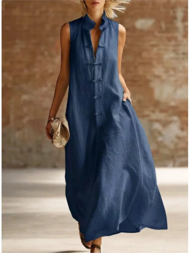 Woman in a versatile sleeveless maxi shirt dress, showcasing its elegant collared design for daily fashion.