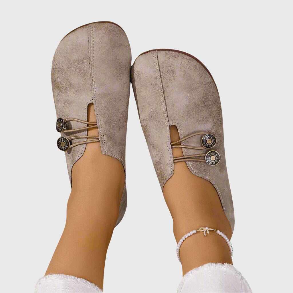Stylish women's slip-on flats, versatile for everyday wear. Features toggle lace & comfortable barefoot feel.