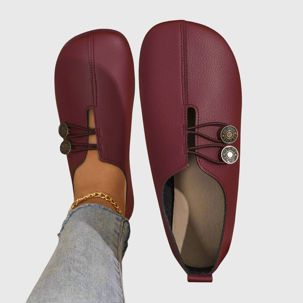 Rear view of women's flat shoes, emphasizing comfortable design & barefoot feel. Ideal casual slip-on footwear.