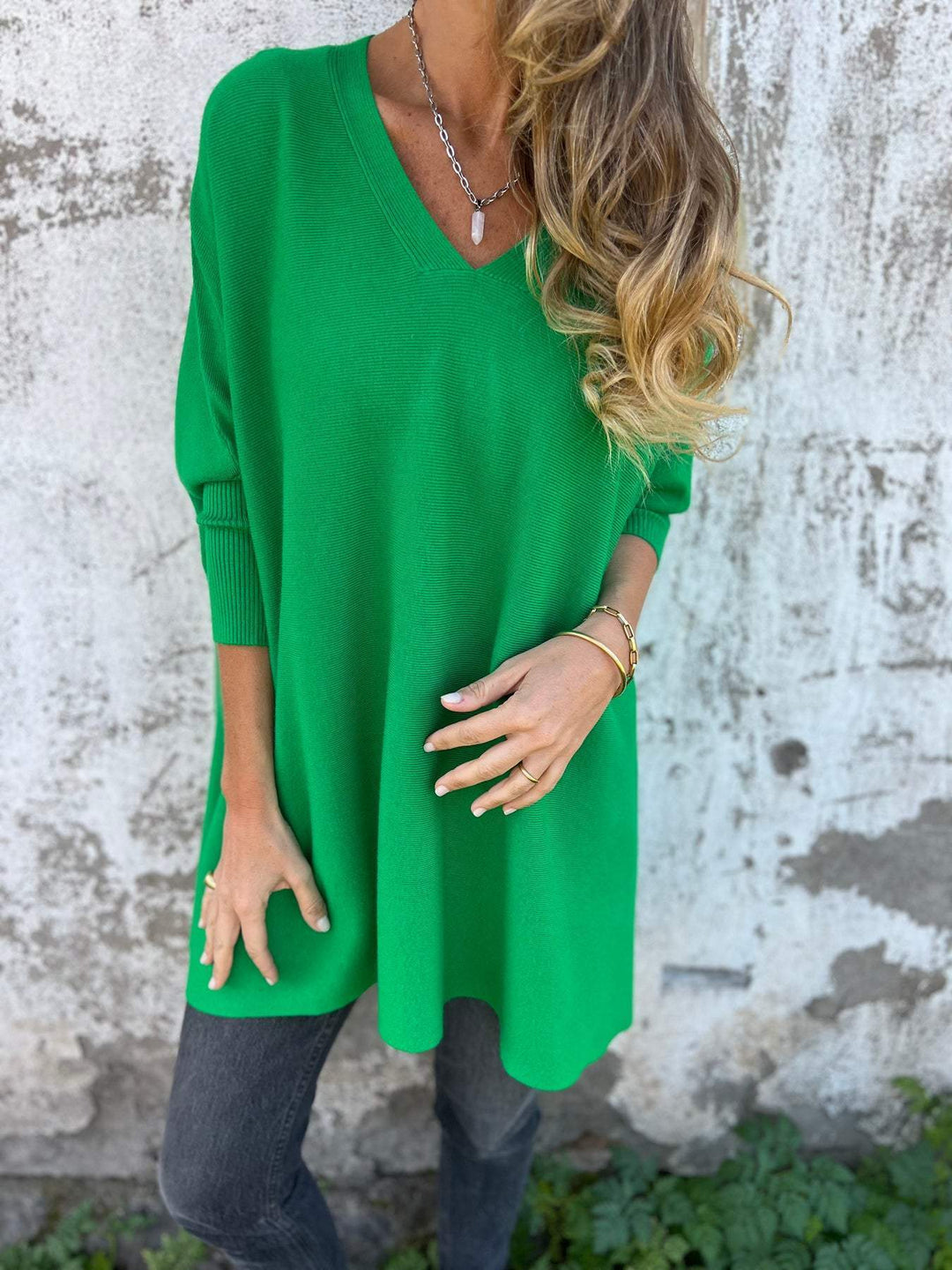 Stylish women's long sleeve V-neck swing tunic sweater. Relaxed fit pullover, ideal for fall & winter comfort.