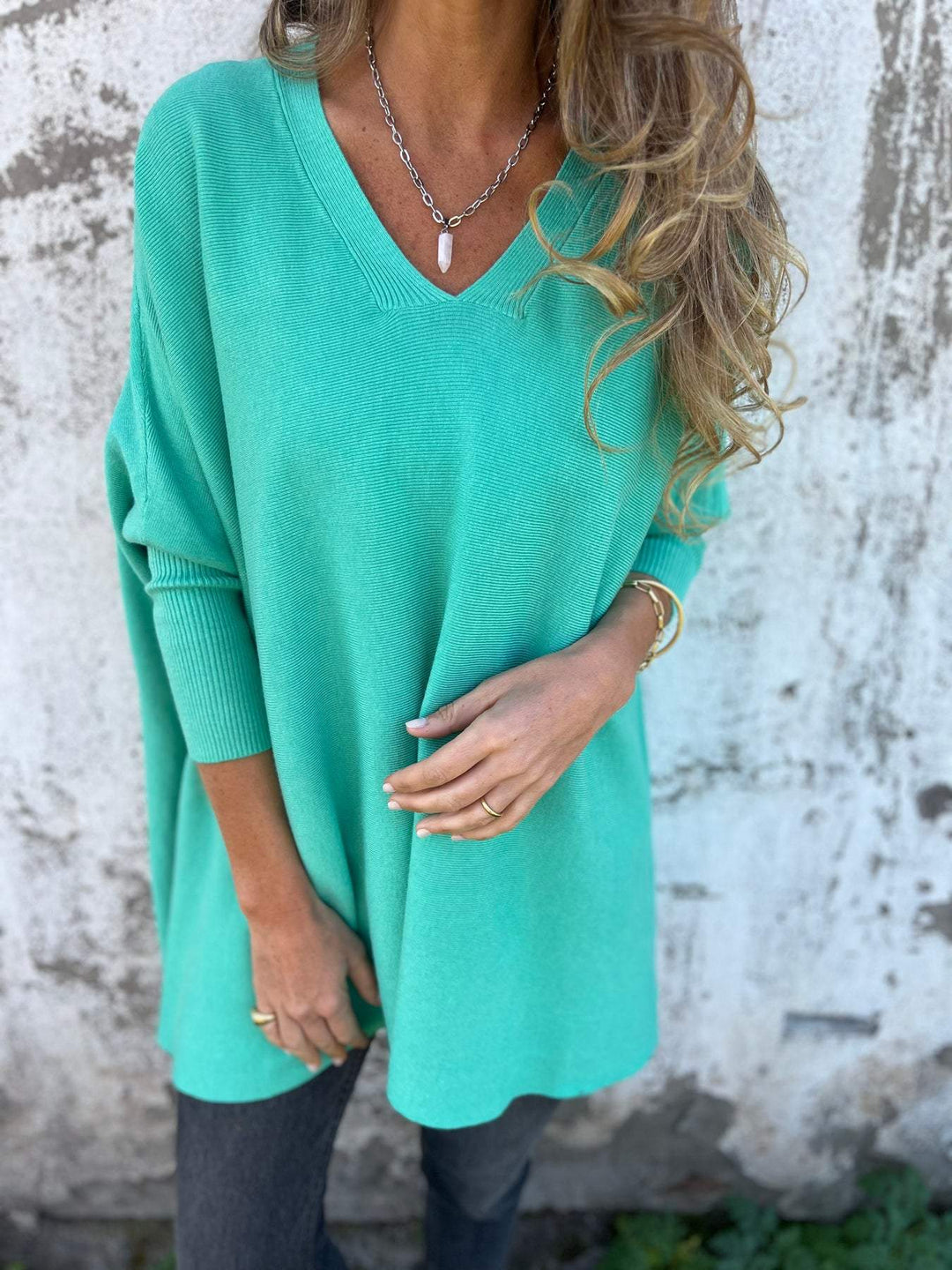 Versatile women's V-neck tunic pullover. Soft, long sleeve swing sweater for effortless casual style.
