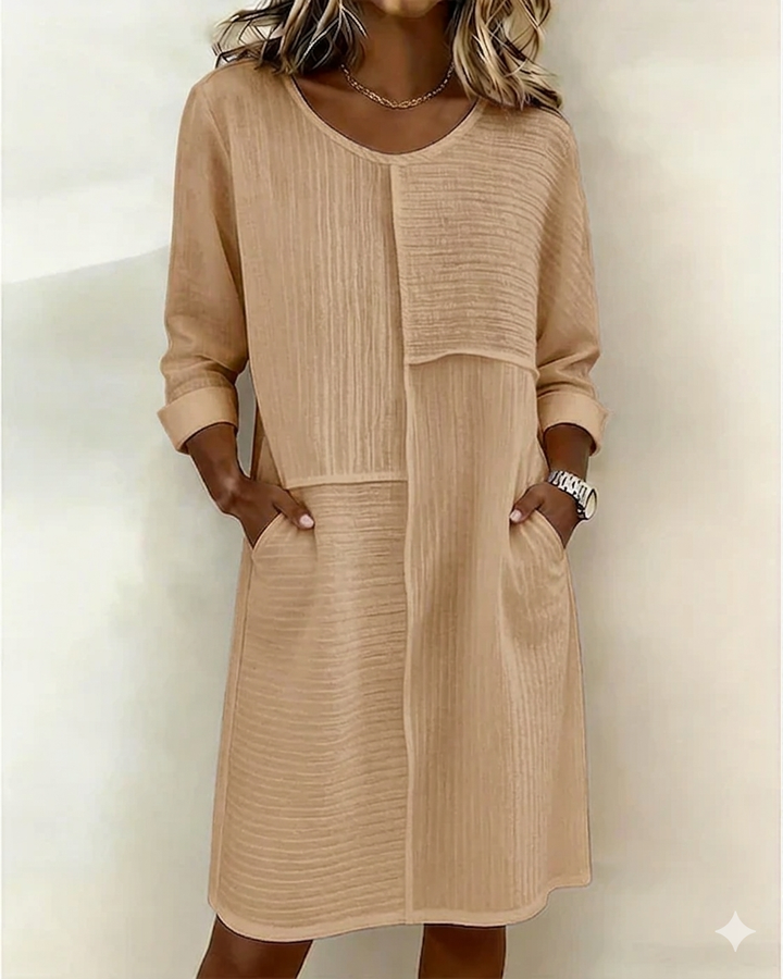 Effortless women's midi shift dress with a unique textured fabric & relaxed fit, suitable for daily fashion.