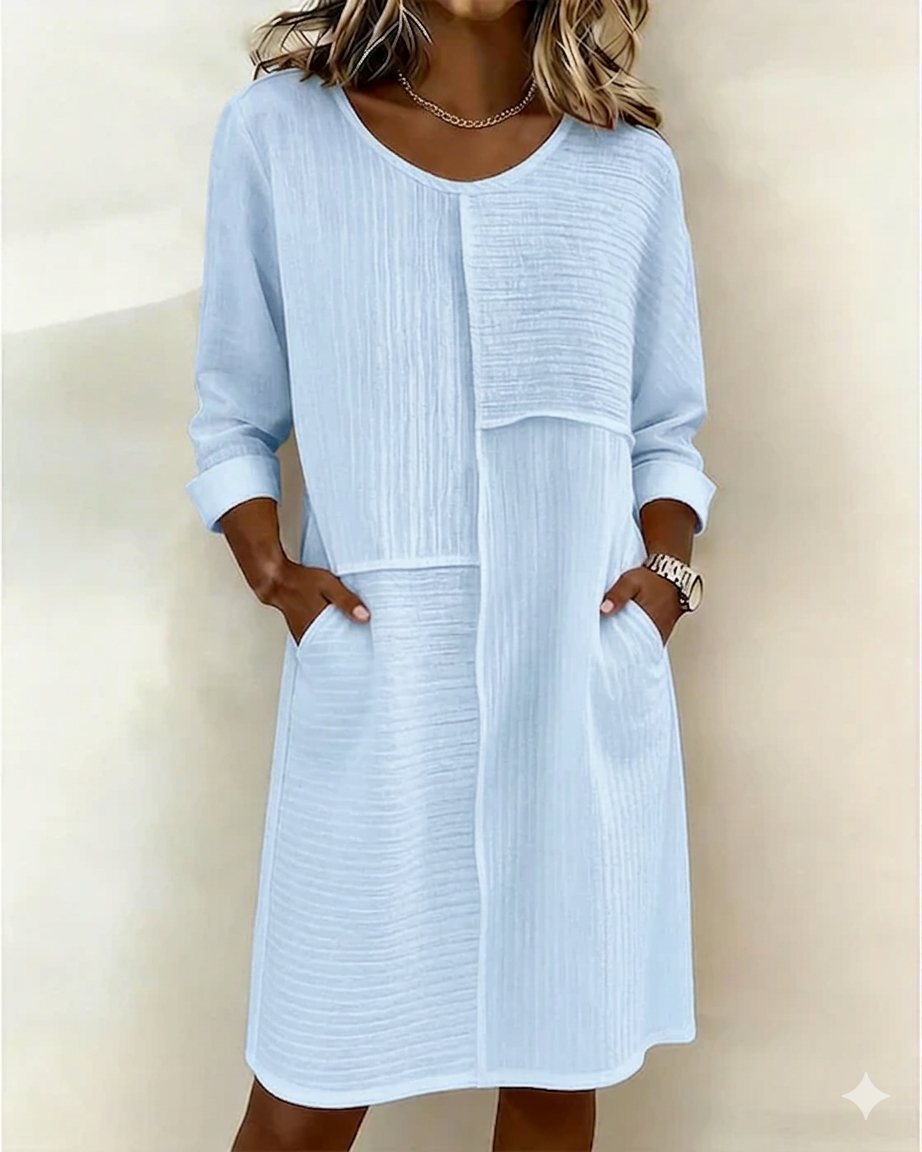 Lightweight summer shift dress for women, featuring a relaxed silhouette, textured design & three-quarter sleeves.
