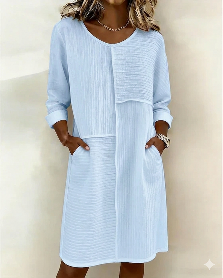 Lightweight summer shift dress for women, featuring a relaxed silhouette, textured design & three-quarter sleeves.