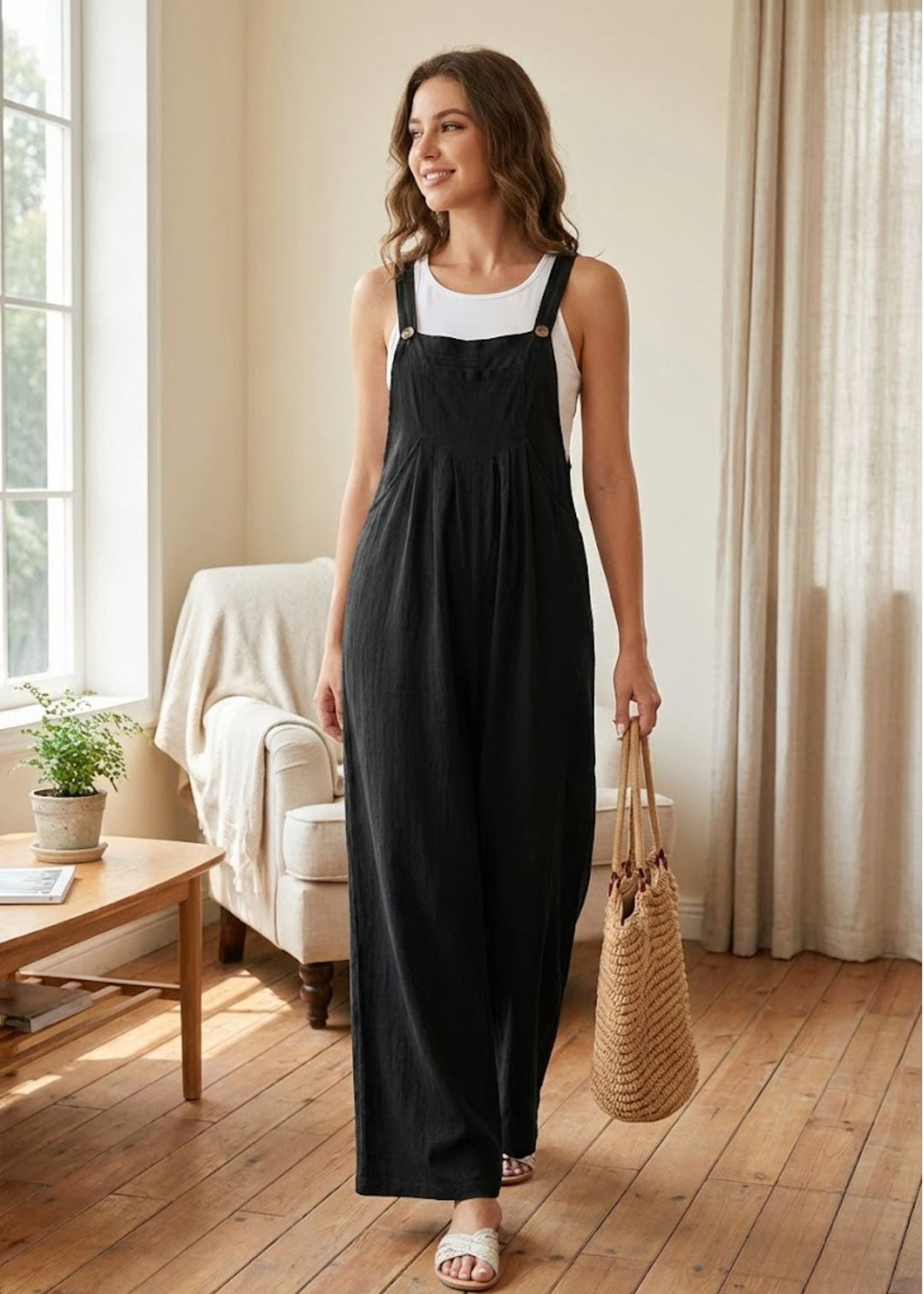 Women's effortless wide leg jumpsuit with adjustable straps & convenient pockets, ideal for summer casual wear.