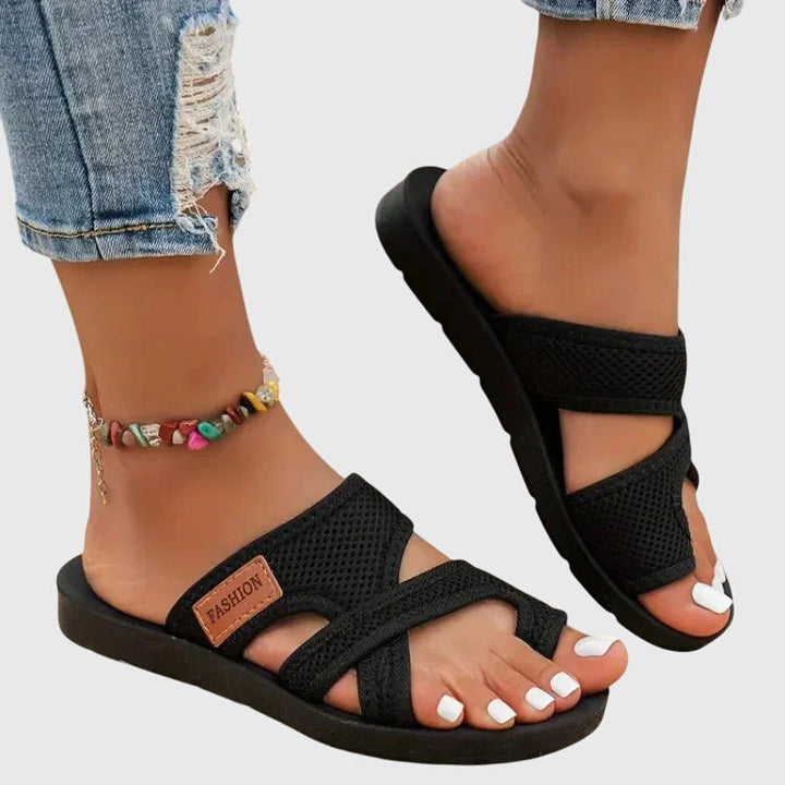 Women's elastic fit orthopedic sandals with contoured arch support & cushioned sole for healthy feet.