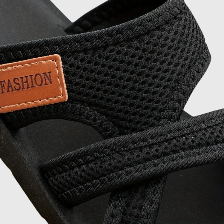 Women's orthopedic sandals with elastic fit, contoured arch support, and cushioned sole for all-day adaptive comfort.