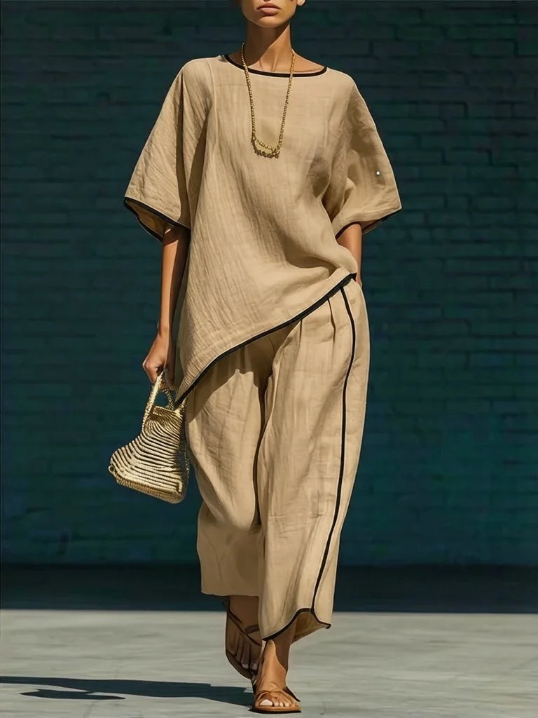 Flattering relaxed fit women's cropped wide leg pant & top set. Chic two-piece for comfortable casual fashion.