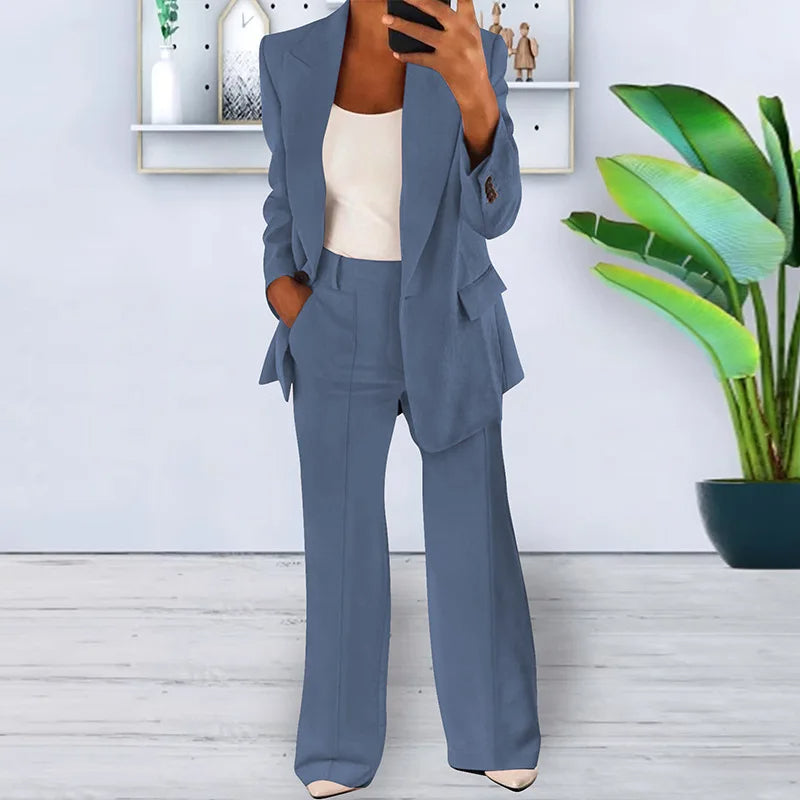 Modern women's business suit: professional blazer & wide-leg trousers, perfect for office attire.