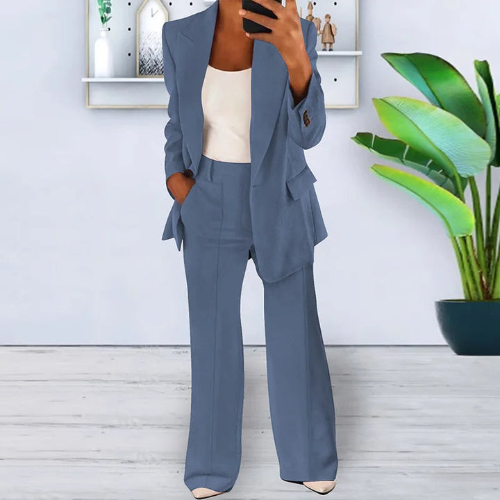 Modern women's business suit: professional blazer & wide-leg trousers, perfect for office attire.