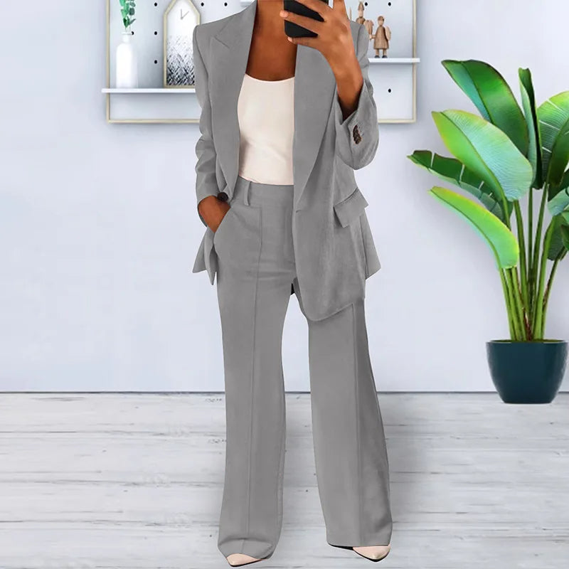 Chic women's power suit, a versatile two-piece set with an elegant blazer & wide-leg trousers for formal wear.