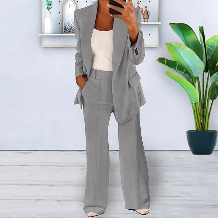 Chic women's power suit, a versatile two-piece set with an elegant blazer & wide-leg trousers for formal wear.