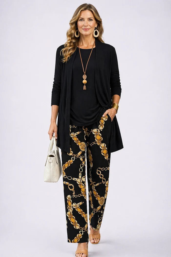 Elegant women's 3-piece set featuring a tailored blazer, classic top, & comfortable relaxed trousers. Versatile look.