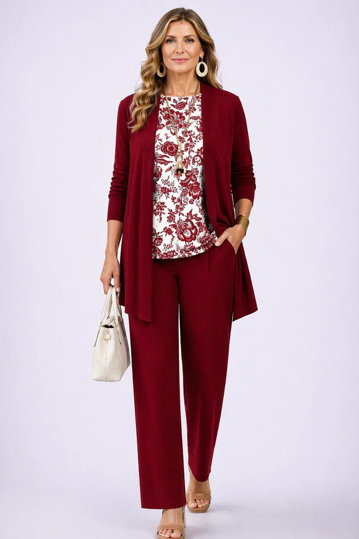 Modern women's fashion 3-piece set: a trendy blazer, matching top, & comfortable relaxed trousers. Coordinated outfit.