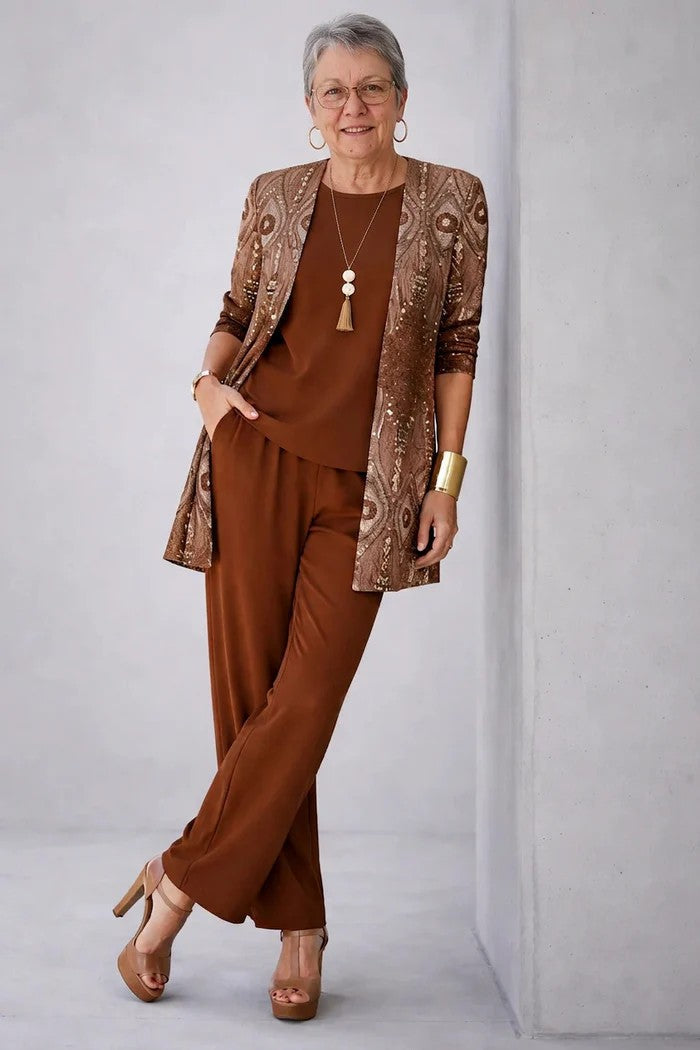 Chic women's blazer set with comfortable relaxed fit trousers & a stylish matching top. Great for modern wear.