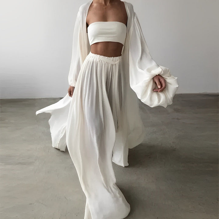 Versatile women's three-piece ensemble including a smart blazer, chic top, and tailored pants for summer fashion.
