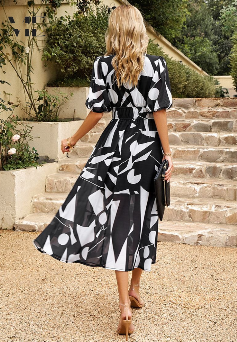 Vibrant women's floral A-line midi dress with short sleeves, a must-have for your summer vacation wardrobe.
