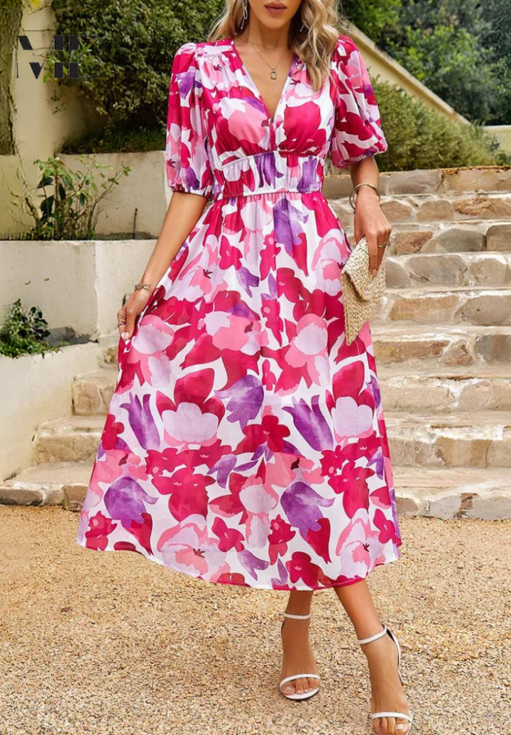 Full length view of women's short sleeve A-line floral midi dress, showcasing its flattering cut.