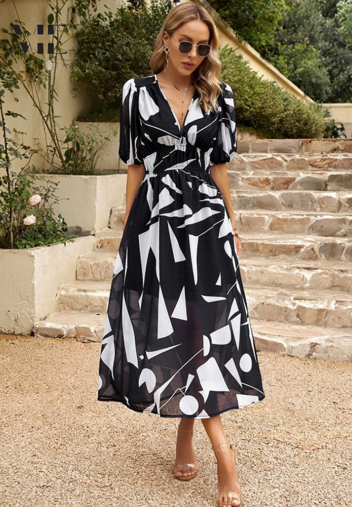 Stylish women's short sleeve A-line midi dress with a colorful floral print, versatile for day or evening.